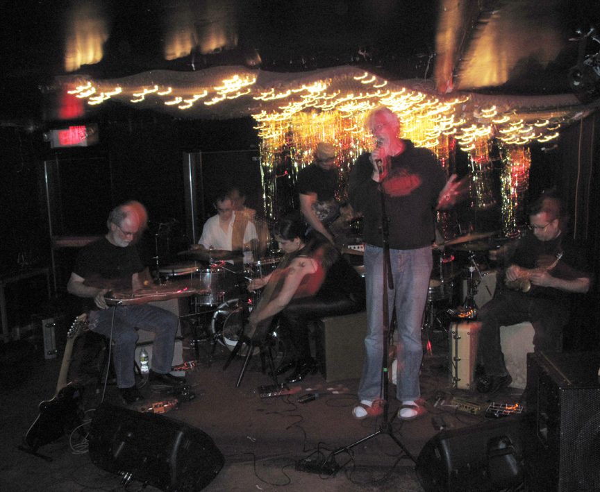 Mia playing electric harp with the Hanuman Sextet John Sinclair reciting poetry with the Hanuman Sextet