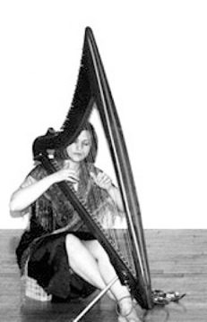 Mia playing an electric Camac Mia playing an electric Camac harp