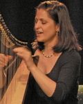 Mia singing and playing Celtic harp at the Irish Arts Center